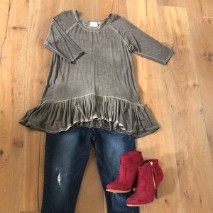 Distressed ruffled bottom top